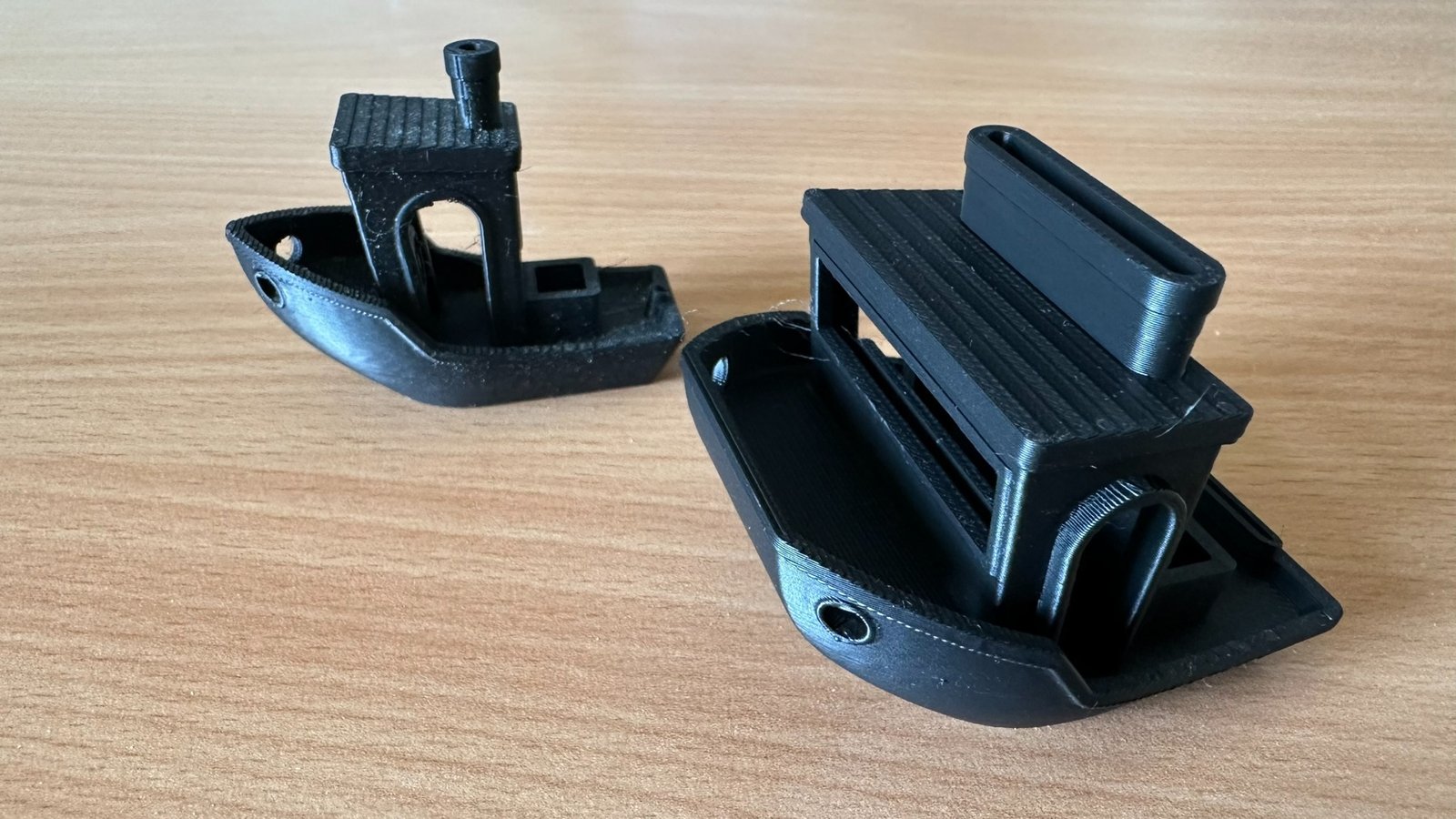 Two physical 3D printed Benchy models used during Point2Solid Studio development